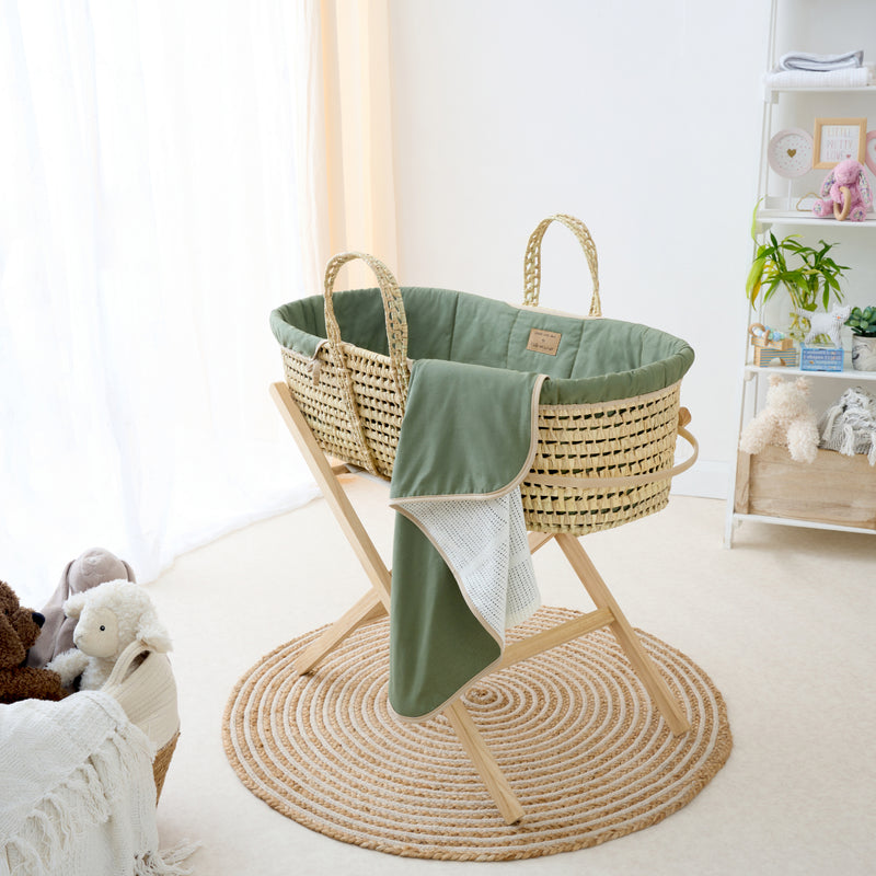 Organic Palm Moses Basket in Forest Green on the Natural Folding Stand with the Forest Green Organic Cellular Blanket | Moses Baskets and Stands | Co-sleepers | Nursery Furniture - Clair de Lune UK