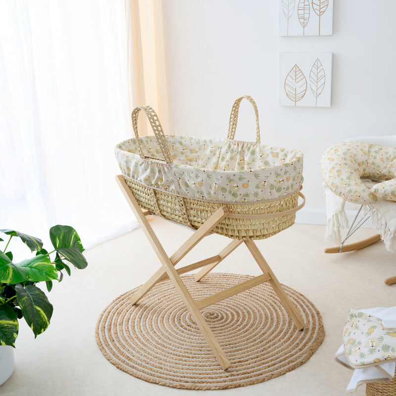 Safari Palm Moses Basket on the Natural Folding Moses Basket Stand in a minimalist nursery | Moses Baskets and Stands | Co-sleepers | Nursery Furniture - Clair de Lune UK