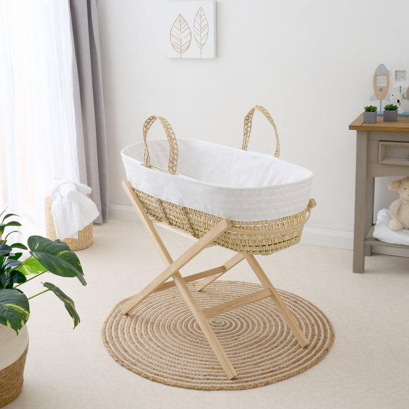 White Scandi Palm Moses Basket on the Clair de Lune Natural Compact Folding Moses Stand in a Scandi style nursery | Moses Baskets and Stands | Co-sleepers | Nursery Furniture - Clair de Lune UK