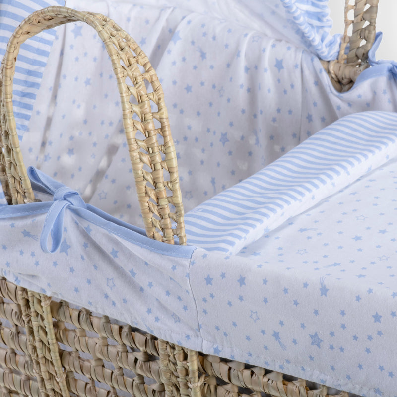 Blue Stars & Stripes Moses Basket Bedding Set including matching coverlet and hood dressed on a natural palm Moses basket with two sturdy palm handles | Moses Basket Dressings | Nursery Bedding & Decor Collections | Nursery Inspiration - Clair de Lune UK