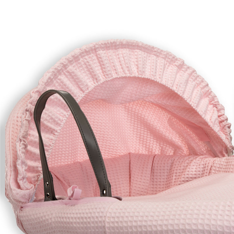 Pink Waffle Grey Wicker Moses Basket showing the sturdy vegan leather carry handles, matching hood and coverlet | Co-sleepers | Nursery Furniture - Clair de Lune UK
