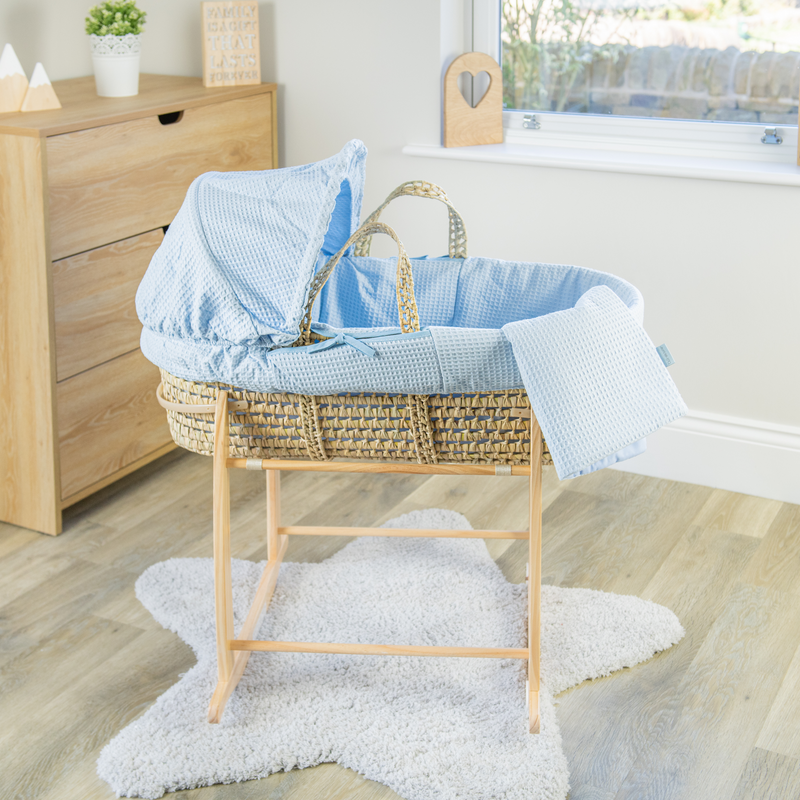 Blue Waffle Palm Moses Basket with the Clair de Lune Natural Compact Folding Moses Stand in a minimalist bedroom | Moses Baskets and Stands | Co-sleepers | Nursery Furniture - Clair de Lune UK