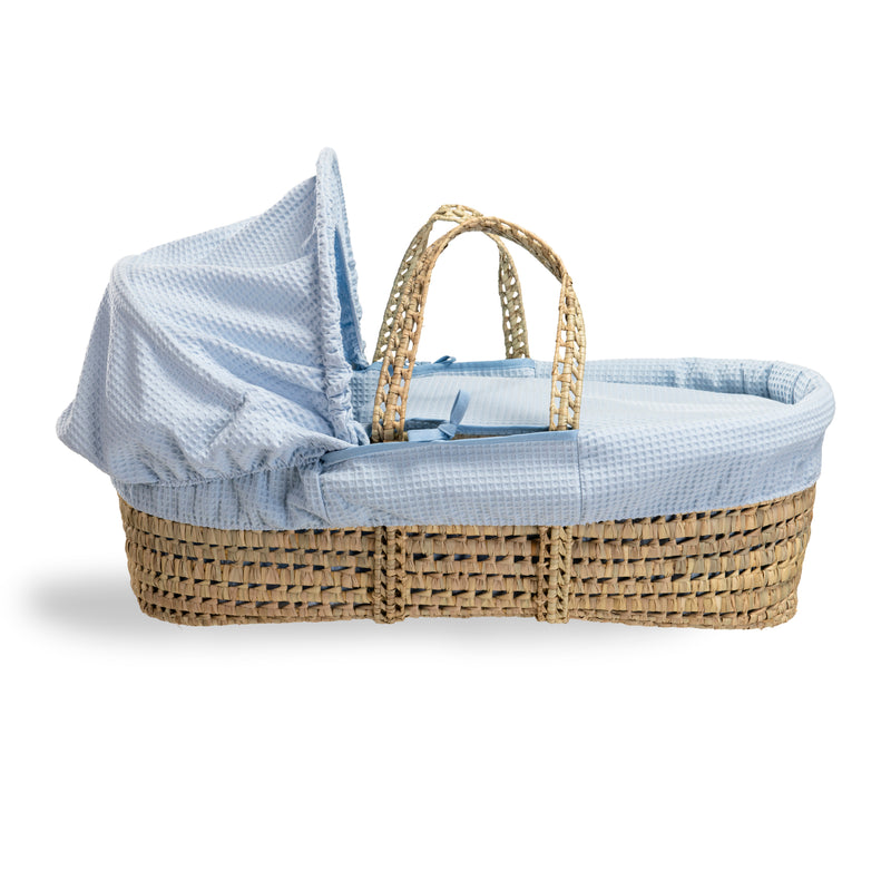 Blue Waffle Palm Moses Basket showing the palm and hood to create a traditional yet cosy sleeping space for babies | Moses Baskets | Co-sleepers | Nursery Furniture - Clair de Lune UK