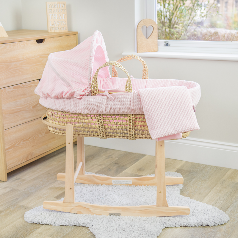 Pink Waffle Palm Moses Basket with the Clair de Lune Natural Compact Folding Moses Stand in a minimalist bedroom | Moses Baskets and Stands | Co-sleepers | Nursery Furniture - Clair de Lune UK