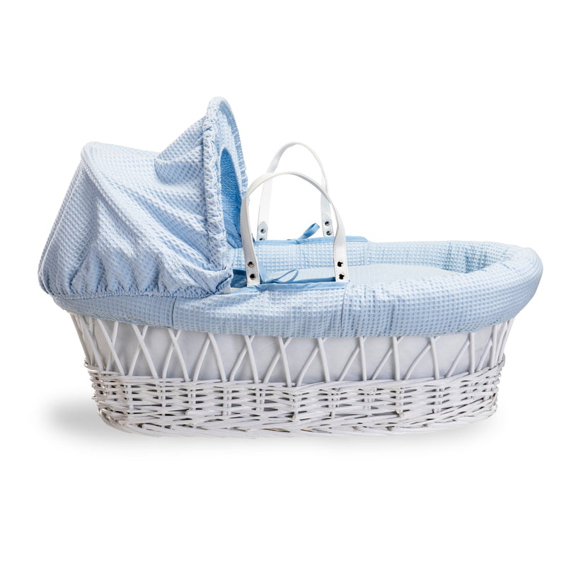 Blue Waffle White Wicker Moses Basket coming complete with an adjustable, removable hood, padded liner that covers the interior walls of the basket, two carry handles, a coverlet, and a firm, hypoallergenic fibre mattress | Co-sleepers | Nursery Furniture