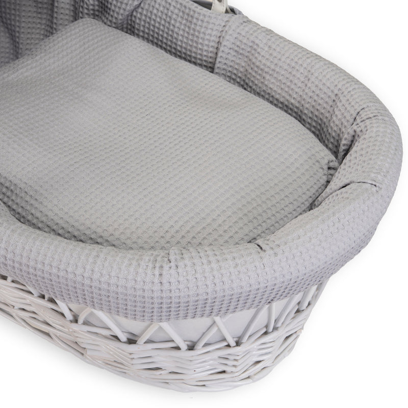 Grey Waffle White Wicker Moses Basket coming complete with a matching coverlet and bassinet dressing made from the breathable grey waffle fabrics | Co-sleepers | Nursery Furniture - Clair de Lune UK