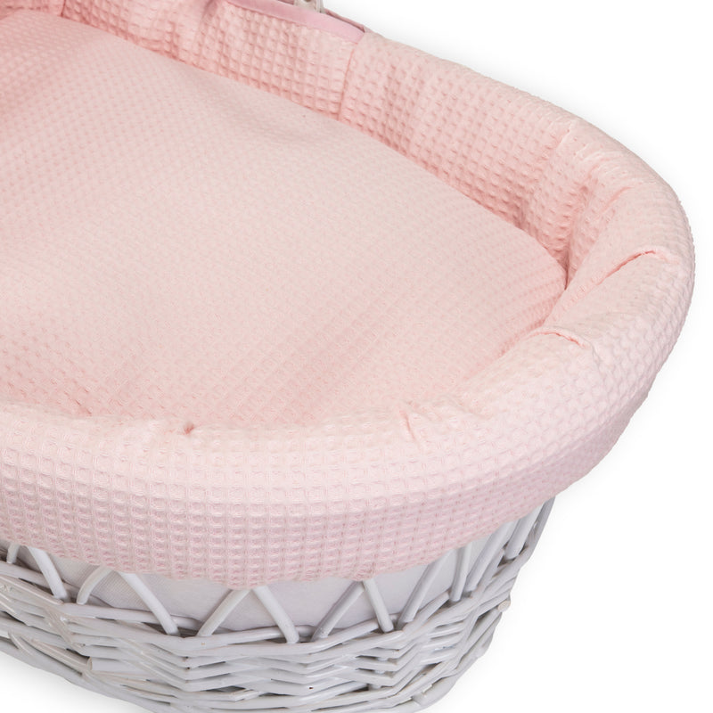 Pink Waffle White Wicker Moses Basket coming complete with a matching coverlet and bassinet dressing made from the breathable pink waffle fabrics | Co-sleepers | Nursery Furniture - Clair de Lune UK