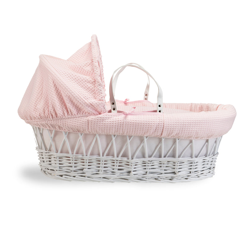 Pink Waffle White Wicker Moses Basket coming complete with an adjustable, removable hood, padded liner that covers the interior walls of the basket, two carry handles, a coverlet, and a firm, hypoallergenic fibre mattress | Co-sleepers | Nursery Furniture