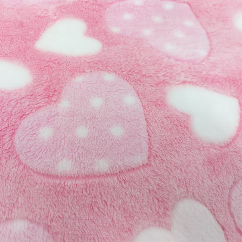 The pink polka and white heart print of the Plush Heart Fleece Baby Blanket | Cosy Baby Blankets | Nursery Bedding | Newborn, Baby and Toddler Essentials - Clair de Lune UK