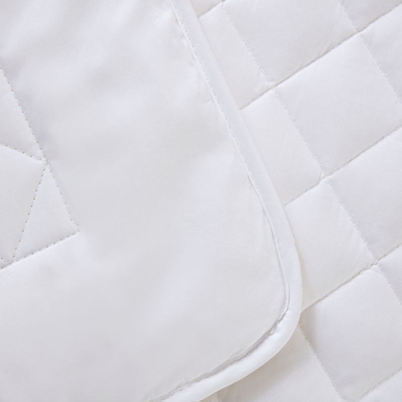 Showcasing the quilted details of the Micro-Fresh® 4.0 Tog Wool Cot Bed Duvet | Cosy Baby Blankets | Nursery Bedding | Newborn, Baby and Toddler Essentials - Clair de Lune UK