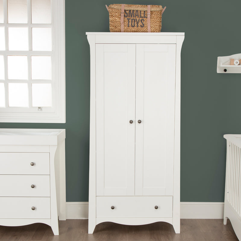 Closed White CuddleCo Clara 2 Door Double Wardrobe in front of a dark green wall | Wardrobes & Shelves | Storage Solutions | Nursery Furniture - Clair de Lune UK