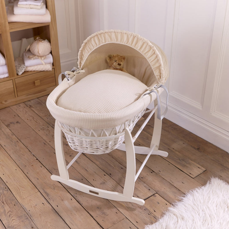 Cream Waffle White Wicker Moses Basket on the White Deluxe Rocking Stand in a minimalist bedroom | Co-sleepers | Nursery Furniture - Clair de Lune UK