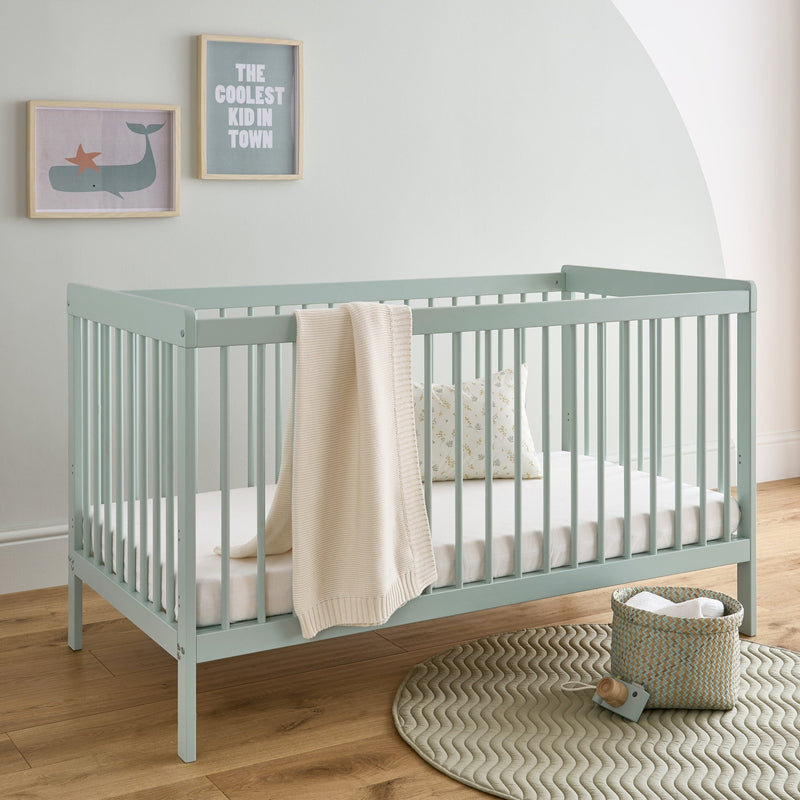 The cot bed of the Sage Green CuddleCo Nola 3 Piece Room Set | Nursery Furniture Sets | Room Sets | Nursery Furniture - Clair de Lune UK