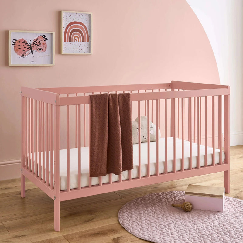 Coral Pink CuddleCo Nola Cot bed in a coral pink Scandi nursery | Cots, Cot Beds, Toddler & Kid Beds | Nursery Furniture - Clair de Lune UK