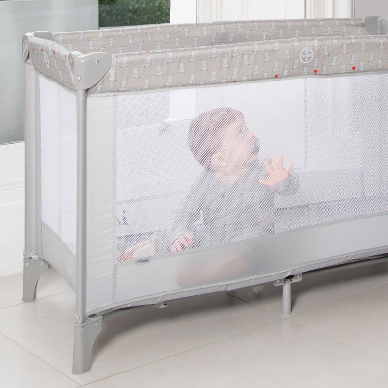 Dani Dyer's baby playing in the My Babiie Dani Dyer Elephants Travel Cot | Travel Cots & Travel Bassinets | Cots, Cot Beds, Toddler & Kid Beds | Nursery Furniture - Clair de Lune UK