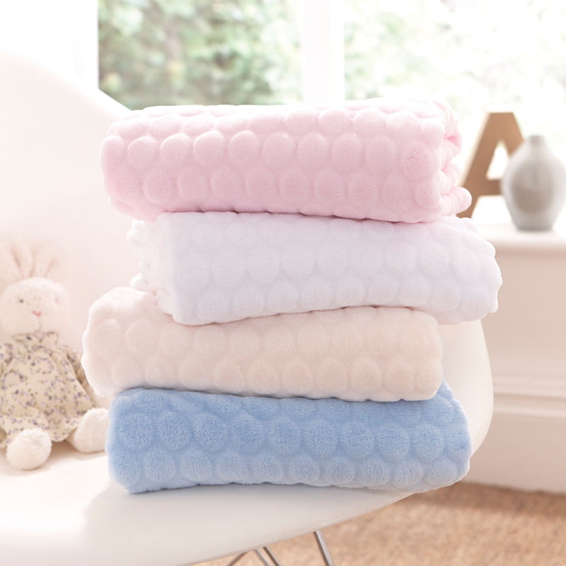 A stack of the Marshmallow Baby Blankets in four colours: blue, white, grey and pink | Cosy Baby Blankets | Nursery Bedding | Newborn, Baby and Toddler Essentials - Clair de Lune UK