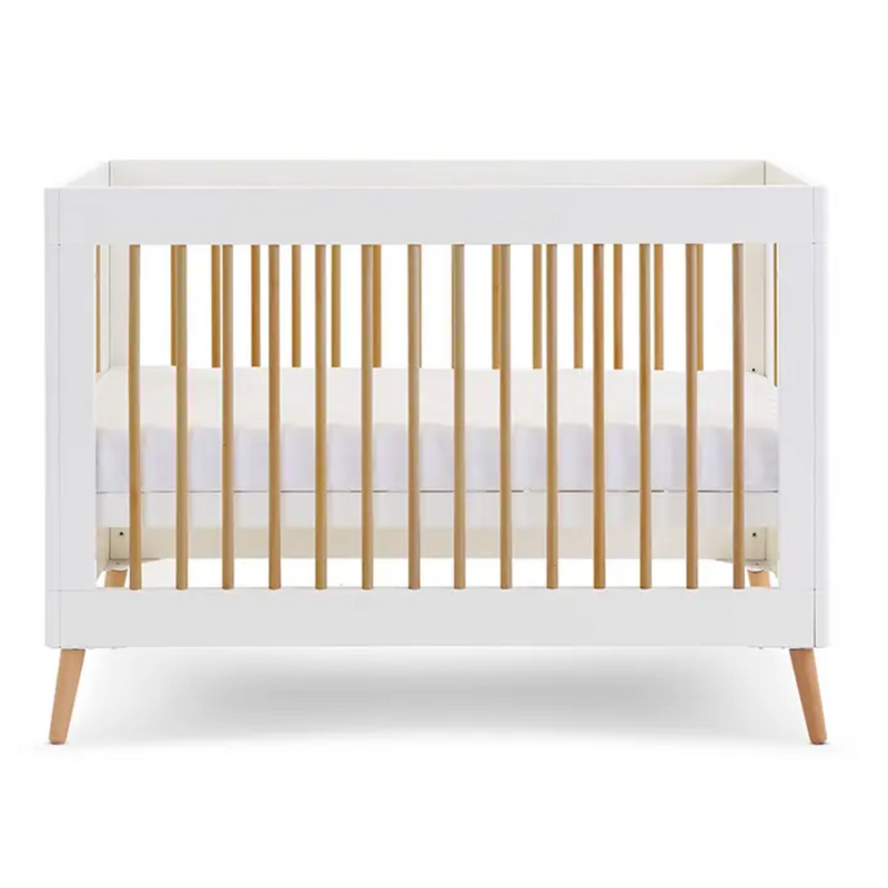  The white cot bed of the Obaby Maya Mini 2 Piece Room Set in white with the adjustable base | Nursery Furniture Sets | Room Sets | Nursery Furniture - Clair de Lune UK