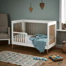 The cot bed from the Obaby Maya Mini 2 Piece Room Set in white transformed to a toddler bed with a white toddler rail | Nursery Furniture Sets | Room Sets | Nursery Furniture - Clair de Lune UK