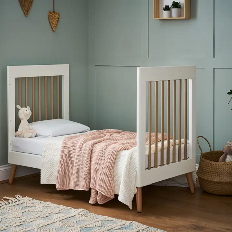 The cot bed from the Obaby Maya Mini 2 Piece Room Set in white transformed to a toddler bed without the side walls | Nursery Furniture Sets | Room Sets | Nursery Furniture - Clair de Lune UK