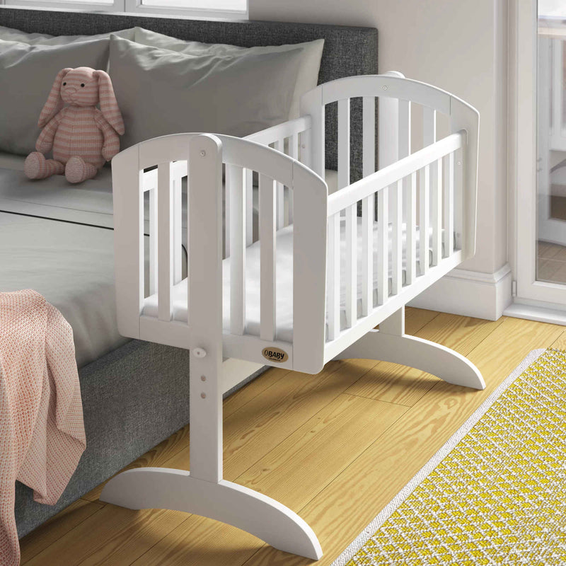 White Obaby Sophie Swinging Crib next to mom's bed | Bedside & Folding Cribs | Next To Me Cots & Newborn Baby Beds | Co-sleepers - Clair de Lune UK