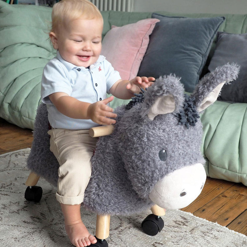 Toddler Boy improving his sensory skills with the Little Bird Told Me Bojangles Donkey Ride On Toy | Baby Walkers and Ride On Toys | Montessori Activities For Babies & Kids | Toys | Baby Shower, Birthday & Christmas Gifts - Clair de Lune UK