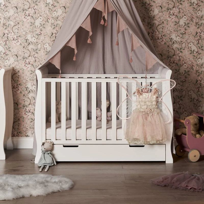 The cot bed of the White Obaby Stamford Mini 3 Piece Room Set in a princess inspired nursery room | Nursery Furniture Sets | Room Sets | Nursery Furniture - Clair de Lune UK