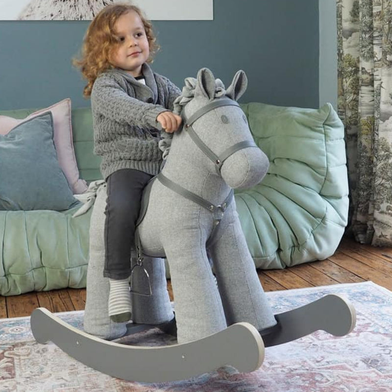 Little boy enjoying his imaginary adventure with the Little Bird Told Me Stirling Rocking Horse | Rocking Animals | Montessori Activities For Babies & Kids | Toys | Baby Shower, Birthday & Christmas - Clair de Lune UK 