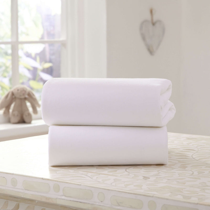 2 Pack White Universal Bedside Crib Fitted Sheets on a counter top | Soft Baby Sheets | Cot, Cot Bed, Pram, Crib & Moses Basket Bedding - Clair de Lune UK