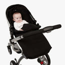 Smiling baby in the Essentials Universal Footmuff | Pushchair Cosytoes & Footmuffs | Travel Accessories - Clair de Lune UK
