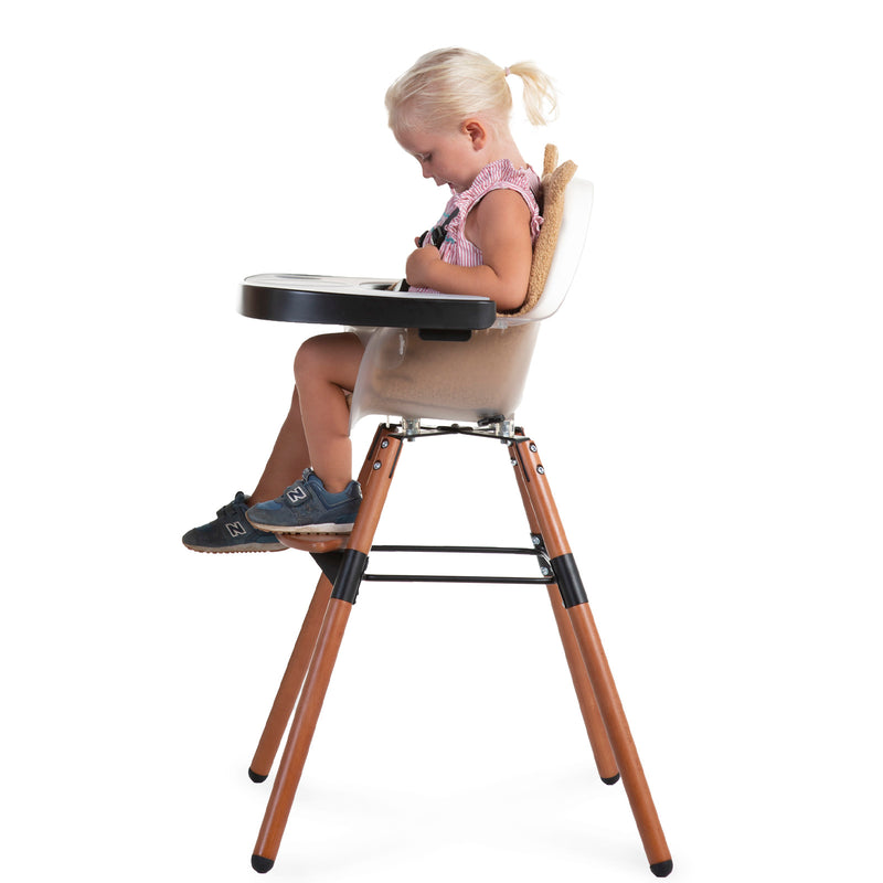 Kid sitting on the Black Childhome Evolu 2 Chair - 2 In 1 with Bumper | Highchairs | Feeding & Weaning - Clair de Lune UK